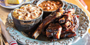  Pork spareribs with sides like mac and cheesePhotography by Scott Suchman