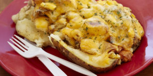  Baked potato with crab, shrimp, and mac and cheese. Photography by Scott Suchman